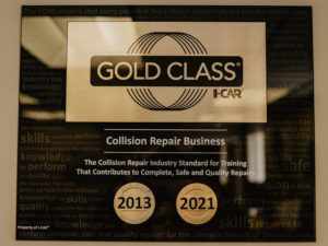 Photo of an I-Car Gold Class certification in a collision repair shop.