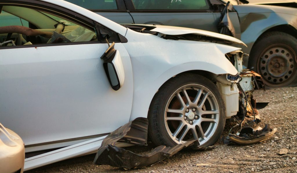 A close up of 2 damaged cars, showing the importance of understanding Maryland car accident statistics,